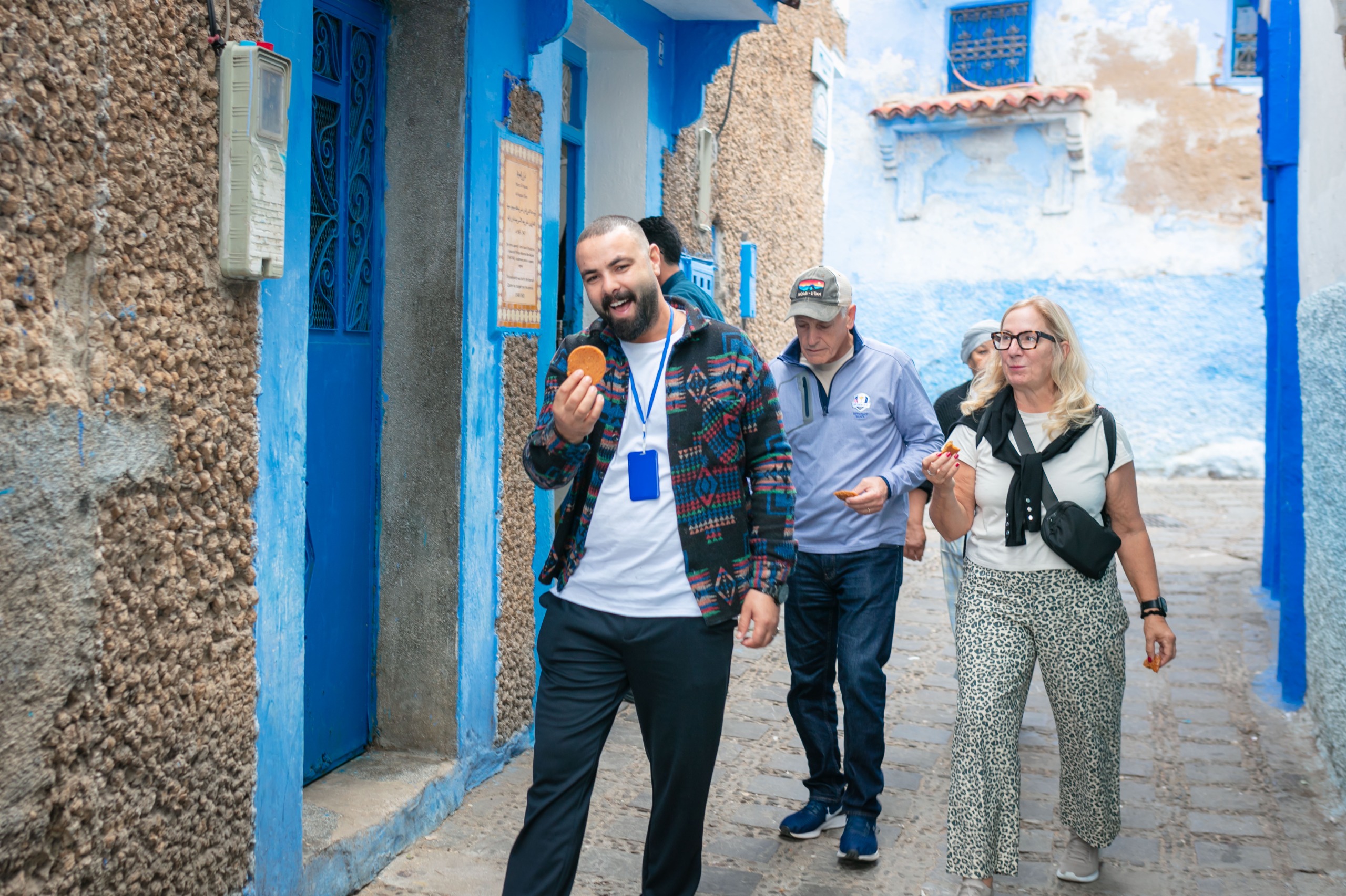Travelers walking through blue alley